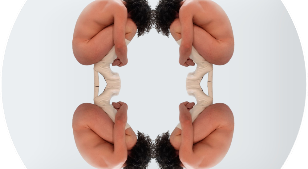 A naked person viewed from the side, hunched over and reflected horizontally and vertically