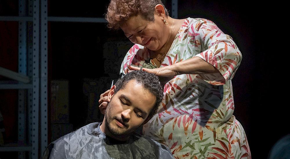Anacarsis getting his hair cut by his mother