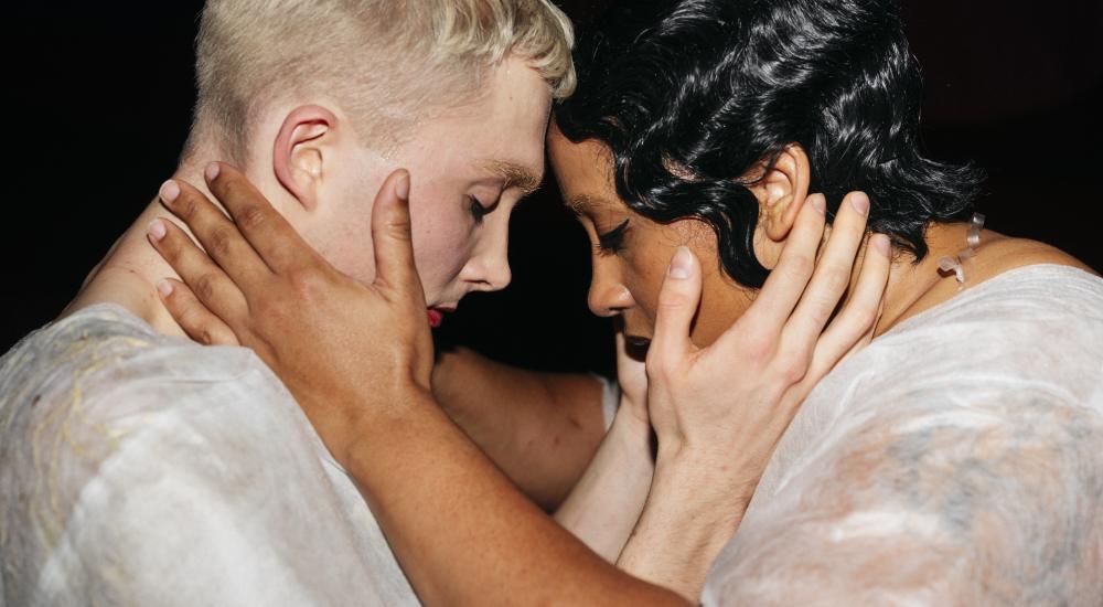 man and woman holding each other's head into their hands