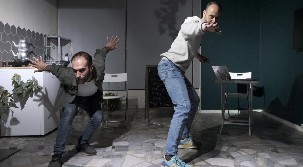 Fatih and Mustafa posing in a grey and white kitchen