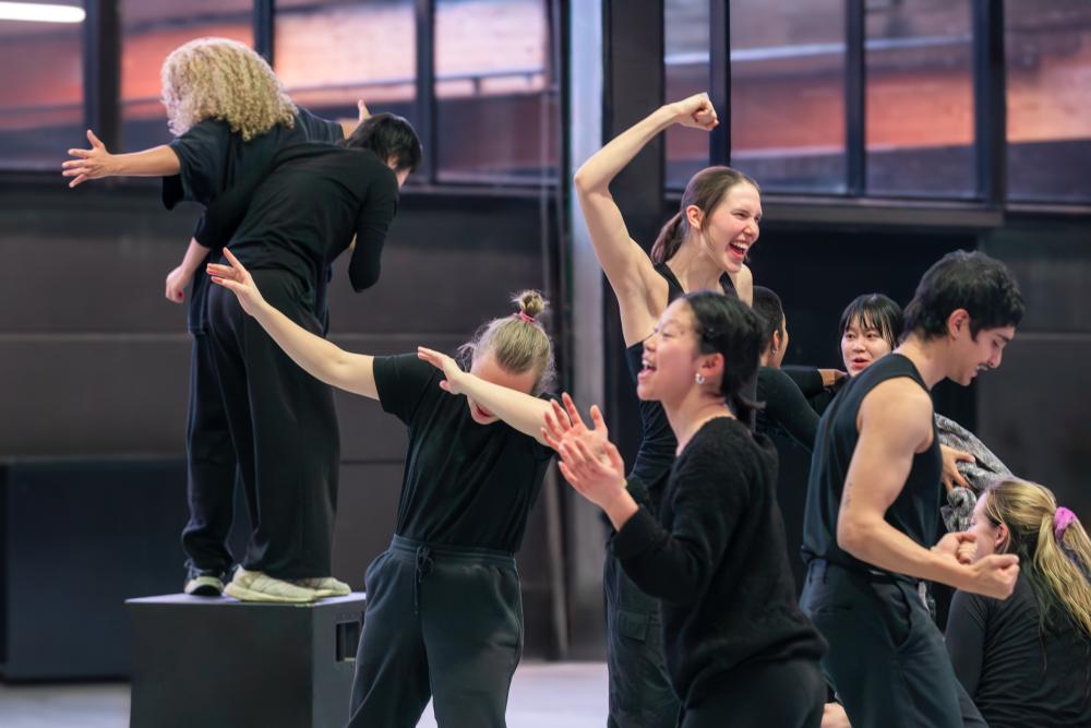 Group of performers wearing black