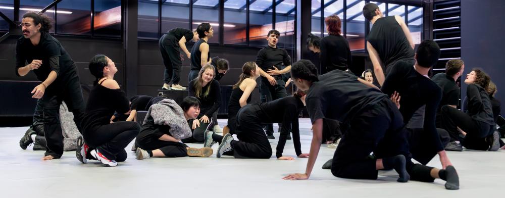 Group of performers wearing black