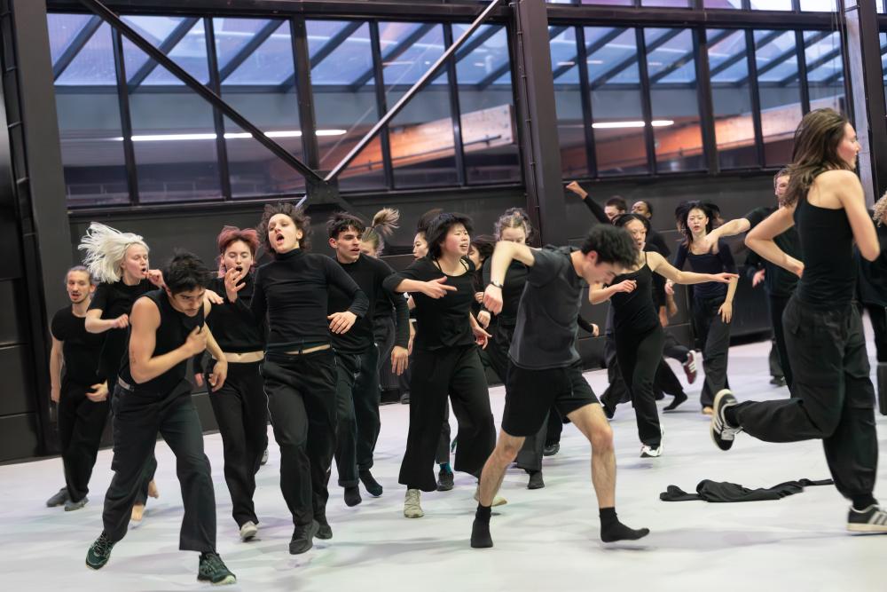 Group of performers wearing black