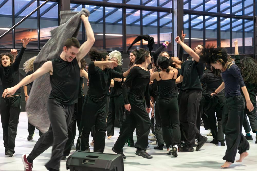 Group of performers wearing black