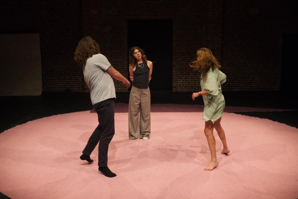 three dancing actors