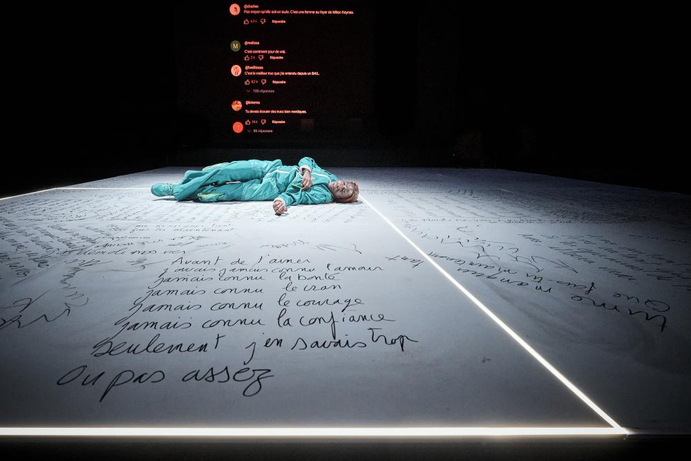 Grace lying on the floor, which is covered in text