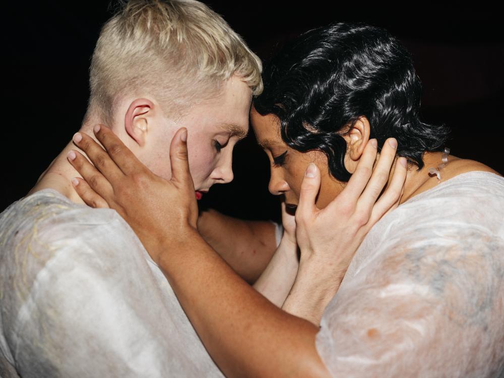 man and woman holding each other's head into their hands