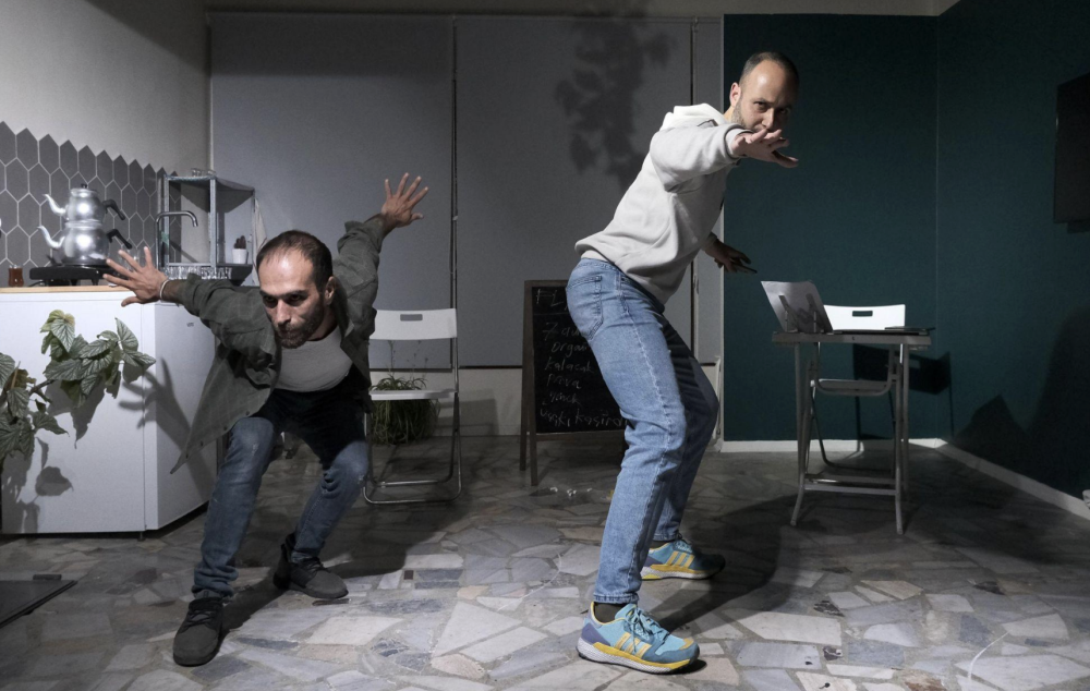 Fatih and Mustafa posing in a grey and white kitchen