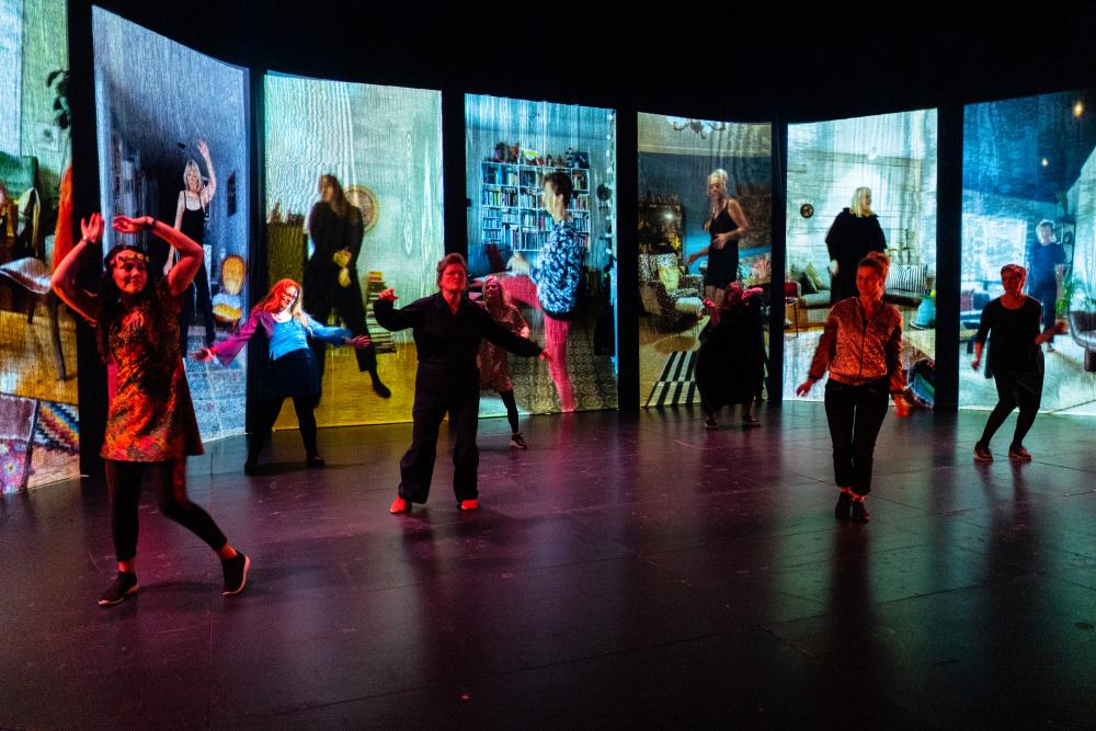 Dancers in front of video projections