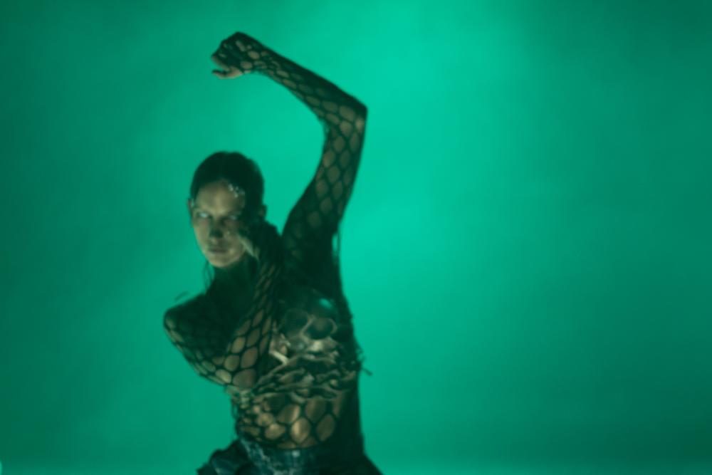 Mercedes in front of a green background