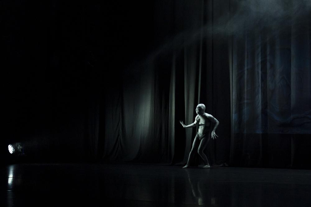 A dancer in a skeleton bodysuit