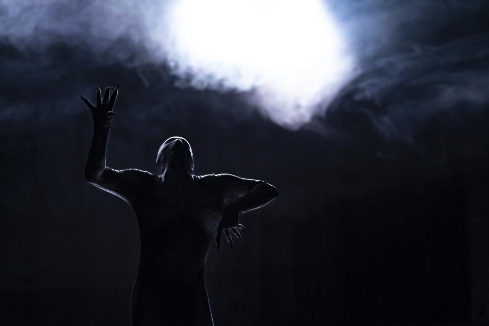 A dancer in a skeleton bodysuit