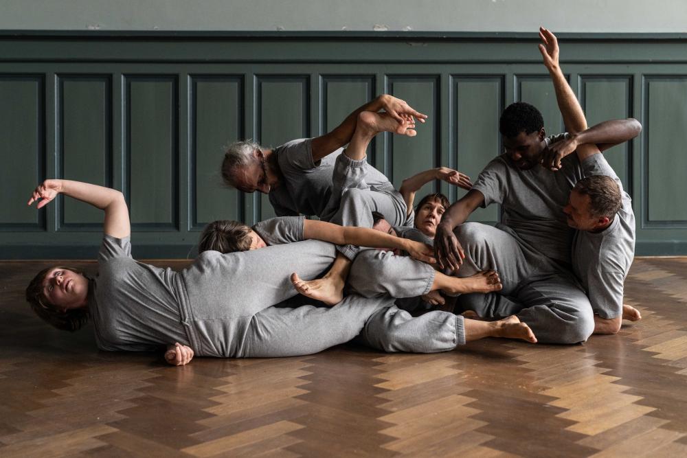 the dancers lying on top of each other