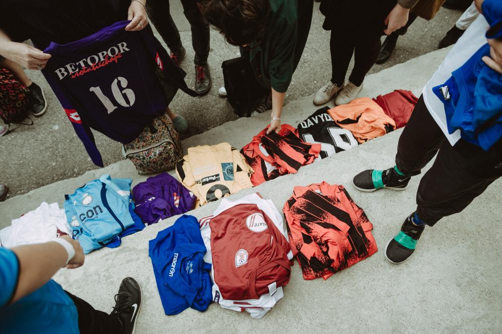 Football shirts piled on the ground