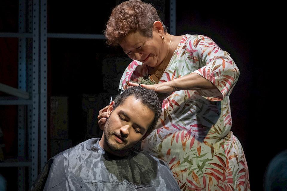 Anacarsis getting his hair cut by his mother