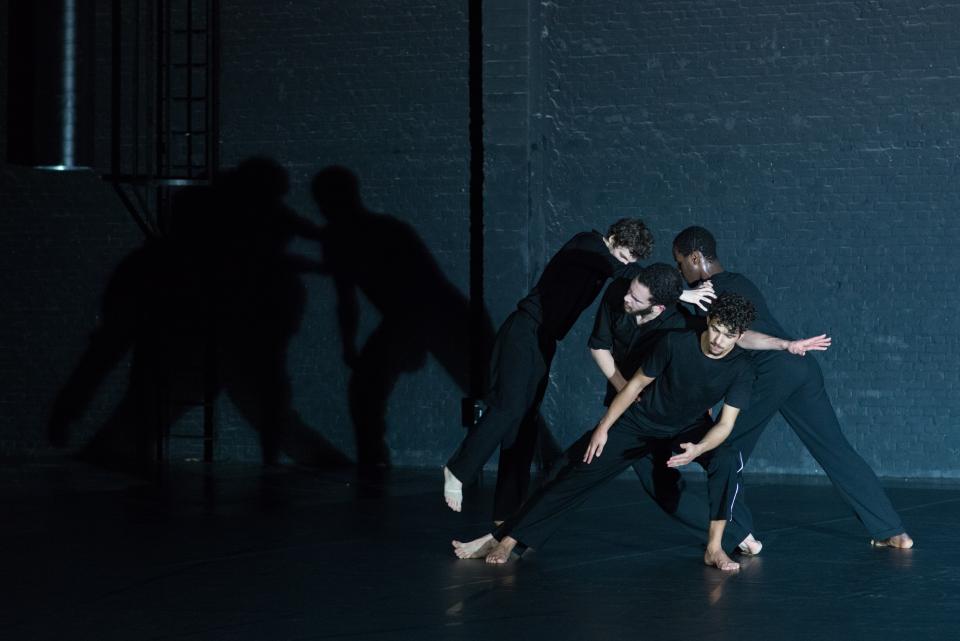 3 male dancers wearing black clothes