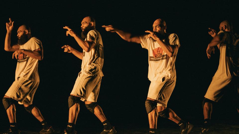 man of colour with beard doing boxing moves