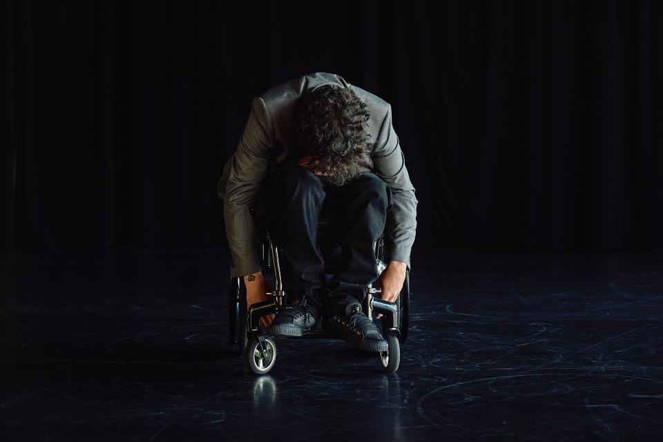 Man in wheelchair on stage