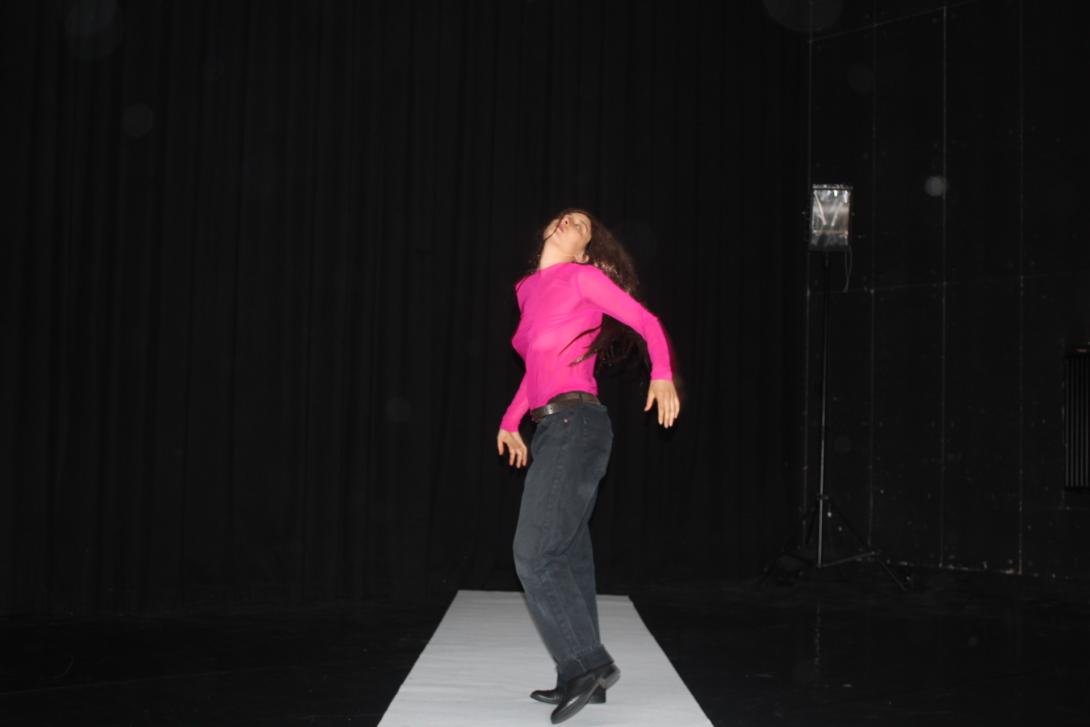 dancing girl with black jeans and pink shirt